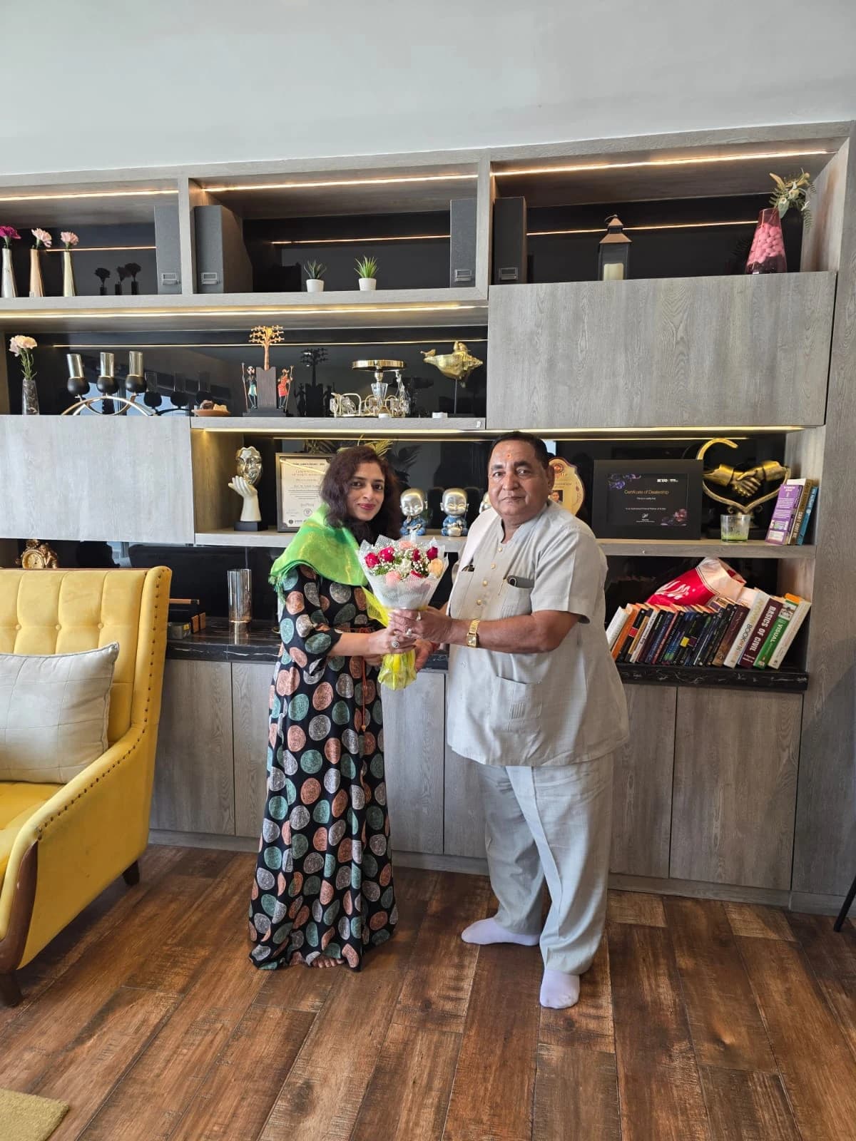 A floral felicitation and a shared moment.