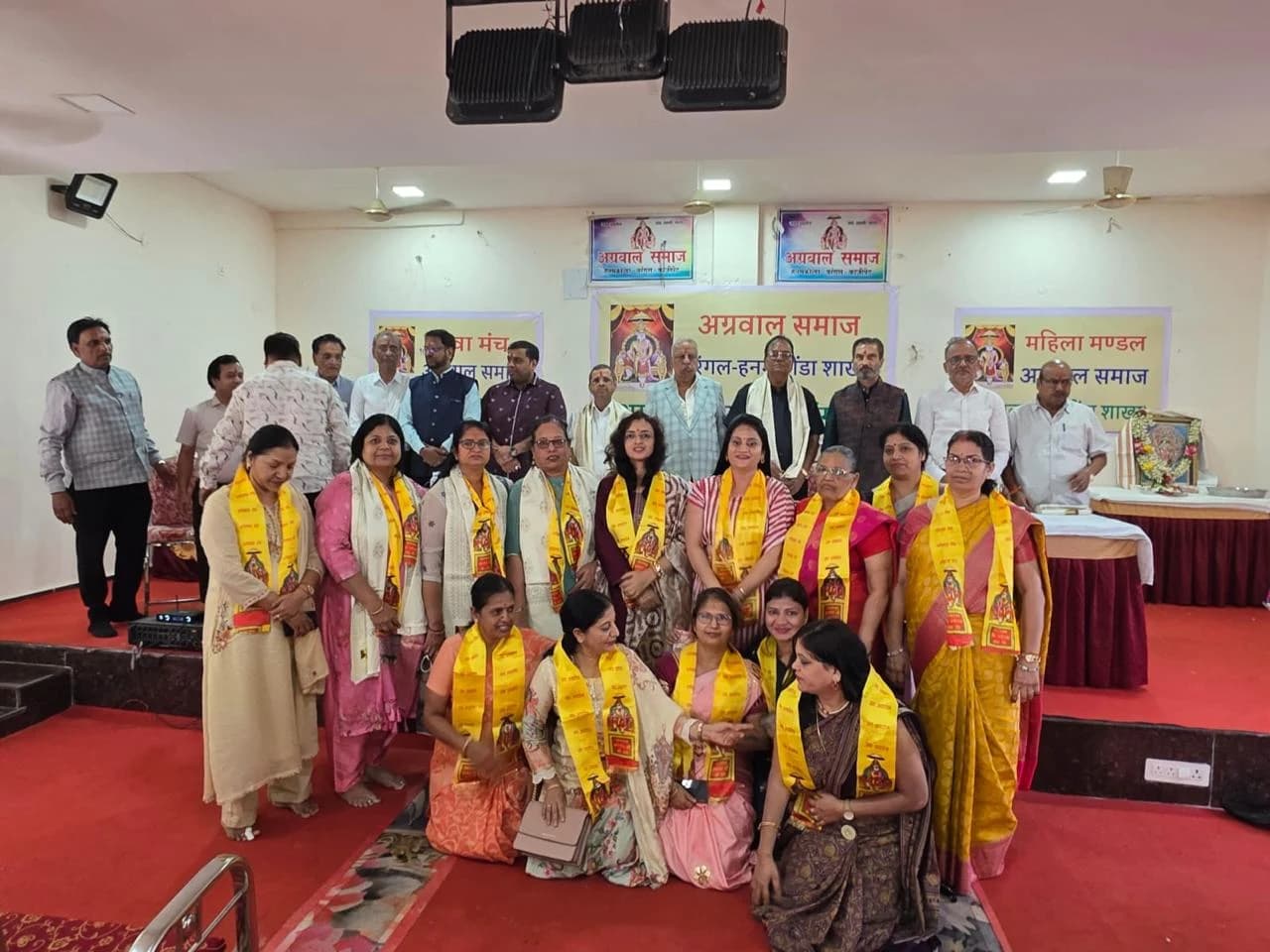 A group photograph with members of the community at the gathering.